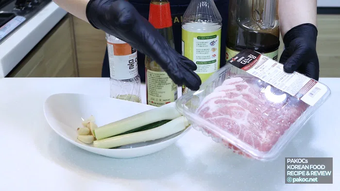 Grilling pork neck in a frying pan