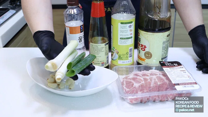 Cutting pork into bite-sized pieces