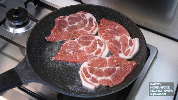 Cooking pork neck thoroughly on both sides