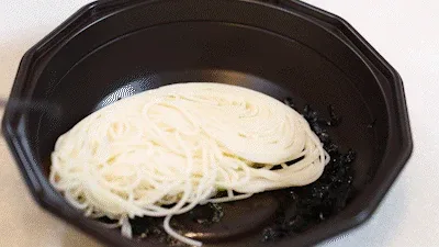 Noodles with a generous garnish setup